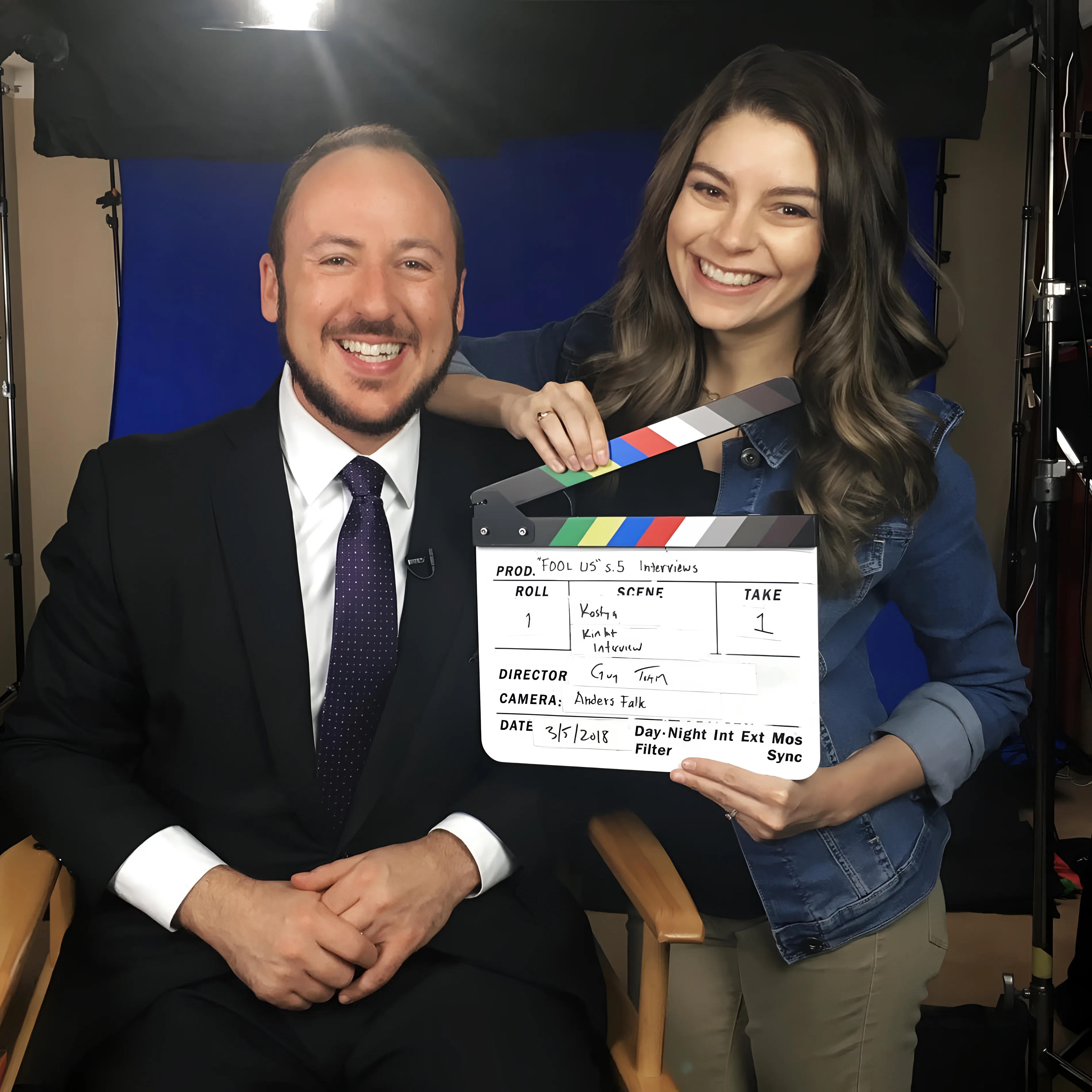 Amy and Kostya Kimlat on the set of Penn & Teller: Fool Us, Amy holding a clapperboard marked Fool Us season five