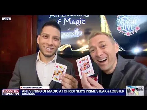 Good Day Orlando presenters holding playing cards during a live segment on An Evening of Magic at Christner’s
